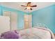 Bedroom featuring bright-blue walls, carpet, window, bed, dresser, and closet at 9311 Windrift Way, Zionsville, IN 46077
