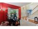 Bright foyer with hardwood floors, staircase, and a large window allowing for abundant natural light at 9311 Windrift Way, Zionsville, IN 46077