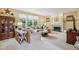 Spacious living room featuring a cozy fireplace, large sectional, and ample natural light at 9311 Windrift Way, Zionsville, IN 46077
