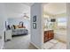Large main bedroom showing ensuite bath with double vanity and separate tub at 9311 Windrift Way, Zionsville, IN 46077