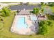 Community pool and basketball court with ample seating, playground, and mature trees at 9311 Windrift Way, Zionsville, IN 46077