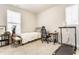 Bright bedroom featuring neutral walls, carpeted floor, a small bed, and a home office area at 965 Astor Ln, Carmel, IN 46032