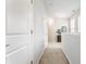 Upstairs hallway featuring carpet flooring and white doors and trim at 965 Astor Ln, Carmel, IN 46032