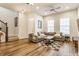 Inviting living room with a comfortable gray sofa, modern ceiling fan, and a cozy checkered rug at 965 Astor Ln, Carmel, IN 46032
