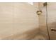 Close-up of tiled shower showcasing a rainfall showerhead and a niche for storage at 965 Astor Ln, Carmel, IN 46032