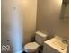 Neat bathroom featuring a functional vanity, toilet, and shower, offering essential amenities at 1002 Brookside Ln, Plainfield, IN 46168