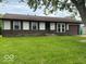 Charming single-story home with a well-maintained front yard and a classic brick facade at 1002 Brookside Ln, Plainfield, IN 46168