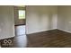 Neutral living room showcasing modern vinyl plank flooring, perfect for relaxation and entertaining at 1002 Brookside Ln, Plainfield, IN 46168