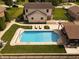 Spacious backyard featuring a pool and deck with plenty of seating space at 1026 Summer Way Dr, Shelbyville, IN 46176