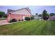 Spacious backyard featuring manicured lawn and fenced area, perfect for outdoor activities at 1026 Summer Way Dr, Shelbyville, IN 46176