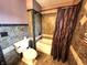A full bathroom with tile walls and a shower/tub combination at 1026 Summer Way Dr, Shelbyville, IN 46176