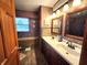 A stylish bathroom has double sinks and tile backsplash at 1026 Summer Way Dr, Shelbyville, IN 46176