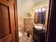 Charming bathroom featuring a unique vessel sink, decorative mirror, and eye-catching wall tile design at 1026 Summer Way Dr, Shelbyville, IN 46176