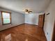 Large bedroom with hardwood floors, natural lighting, and a ceiling fan at 1026 Summer Way Dr, Shelbyville, IN 46176