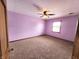 Comfortable bedroom with carpet, ceiling fan, and a window at 1026 Summer Way Dr, Shelbyville, IN 46176
