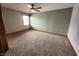 Cozy bedroom with carpet, a ceiling fan, and a window at 1026 Summer Way Dr, Shelbyville, IN 46176
