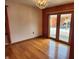 Open dining area with hardwood floors and sliding door access to the deck at 1026 Summer Way Dr, Shelbyville, IN 46176