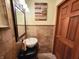 This half bath features a vessel sink and updated finishes at 1026 Summer Way Dr, Shelbyville, IN 46176