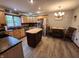 Kitchen features stainless steel appliances, black countertops and a kitchen island at 1026 Summer Way Dr, Shelbyville, IN 46176