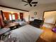 Open-concept living room with hardwood floors, lots of space, and a ceiling fan at 1026 Summer Way Dr, Shelbyville, IN 46176