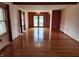 Bright living room with hardwood floors and sliding glass doors to the pool at 1026 Summer Way Dr, Shelbyville, IN 46176