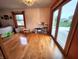 Living room boasts gleaming hardwood floors and access to a deck at 1026 Summer Way Dr, Shelbyville, IN 46176