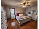 A spacious main bedroom features white trim and hardwood floors at 1026 Summer Way Dr, Shelbyville, IN 46176
