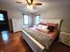 A spacious main bedroom features white trim and hardwood floors at 1026 Summer Way Dr, Shelbyville, IN 46176