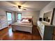 A spacious main bedroom features white trim and hardwood floors at 1026 Summer Way Dr, Shelbyville, IN 46176