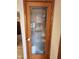 Wood-framed pantry door with a frosted glass decorative design at 1026 Summer Way Dr, Shelbyville, IN 46176