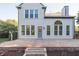 Rear exterior features a patio, well manicured flower beds, and access to home at 107 W Columbine Ln, Westfield, IN 46074