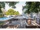 Inviting backyard patio with built-in grill and prep area, adjacent to a sparkling pool and lush landscaping at 107 W Columbine Ln, Westfield, IN 46074