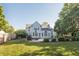 Spacious backyard featuring a sparkling swimming pool, lush greenery, and an inviting patio area at 107 W Columbine Ln, Westfield, IN 46074
