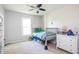 Neutral bedroom with a window and carpet, furnished with a bed, dresser and teddy bear at 107 W Columbine Ln, Westfield, IN 46074