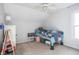 A light and airy bedroom with a sloped ceiling, ceiling fan, carpeted floors and a neutral color palette at 107 W Columbine Ln, Westfield, IN 46074