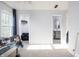 Bright bedroom with a window, blue curtains, carpeted floors and access to other rooms at 107 W Columbine Ln, Westfield, IN 46074