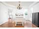 Bright dining area featuring a table with a chandelier, wooden floors, and ample natural light at 107 W Columbine Ln, Westfield, IN 46074