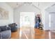 Inviting entryway boasting two chairs, a bay window, and a coat rack near the front door at 107 W Columbine Ln, Westfield, IN 46074
