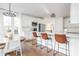 Elegant kitchen featuring a large island, modern lighting, and white cabinetry at 107 W Columbine Ln, Westfield, IN 46074