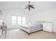 Bright bedroom with a vaulted ceiling, plush bed, and large windows for abundant natural light at 107 W Columbine Ln, Westfield, IN 46074