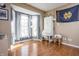 Home office with a bay window, hardwood floors, desk, storage, and natural light at 107 W Columbine Ln, Westfield, IN 46074