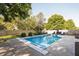 The backyard boasts a pristine pool surrounded by lush greenery, offering a serene escape and space for outdoor enjoyment at 107 W Columbine Ln, Westfield, IN 46074