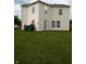 Spacious backyard and lawn featuring mature trees at 10795 Albertson Dr, Indianapolis, IN 46231