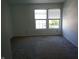 Standard, empty bedroom featuring carpeted floors and natural light from windows at 10795 Albertson Dr, Indianapolis, IN 46231