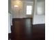 Open-concept living area with sleek dark flooring and an inviting atmosphere at 10795 Albertson Dr, Indianapolis, IN 46231