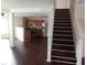 Inviting living space flows into the kitchen, featuring dark floors and ample natural light at 10795 Albertson Dr, Indianapolis, IN 46231