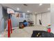 Finished basement provides ample space with a basketball hoop, hockey net, and cozy beanbag at 10988 Eaton Ct, Fishers, IN 46038