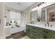 Stylish bathroom featuring a double vanity, a soaking tub, and elegant finishes at 10988 Eaton Ct, Fishers, IN 46038