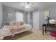 Cozy bedroom with neutral walls, plush carpet and a charming white metal bed frame at 10988 Eaton Ct, Fishers, IN 46038