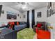 Bedroom with fun decor, gray walls, and a sitting area with a comfortable armchair at 10988 Eaton Ct, Fishers, IN 46038